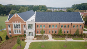An exterior drone photo of the Moye Pharmacy and Health Sciences Building