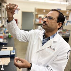 Dr. Mahavir Chougle in a Mercer lab